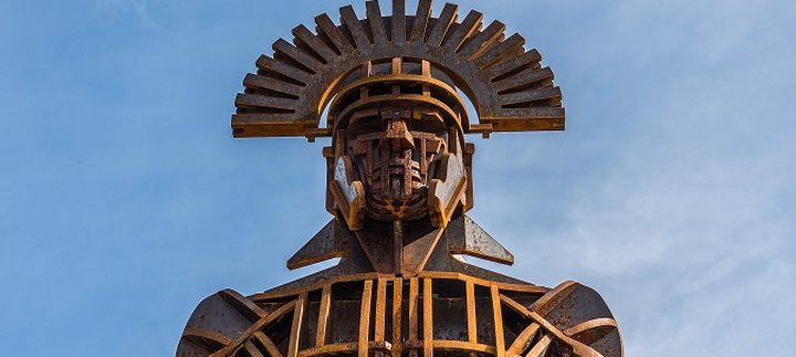 Weathered steel statue of a centurion