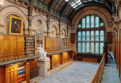 Large victorian hall with stained glass window