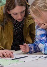 Parent and child drawing together 