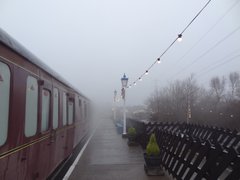 Train on platform with fairy lights