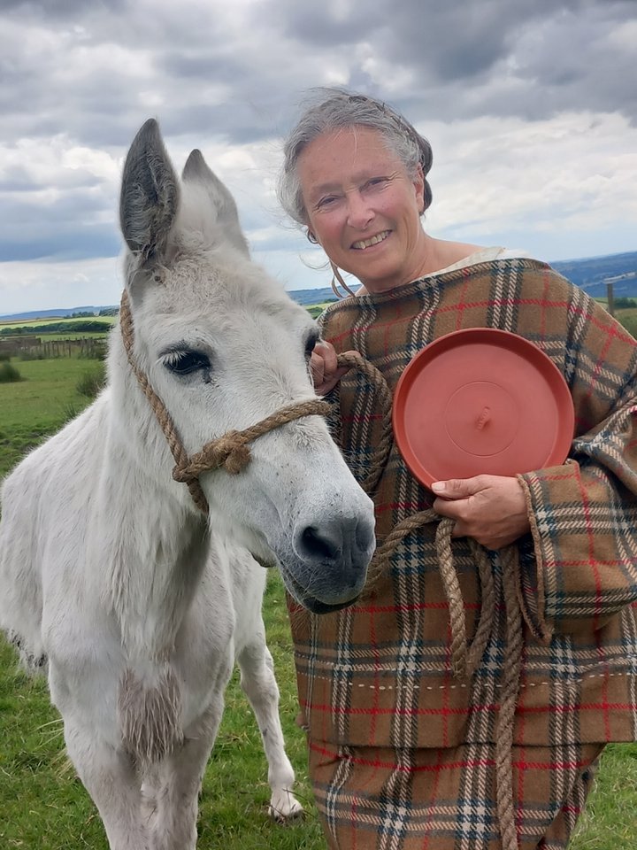 White mule with woman dressed in plaid