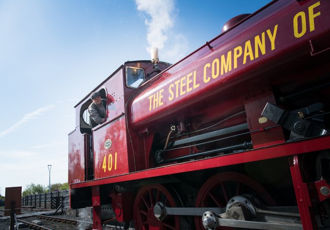 Red locomotive with driver