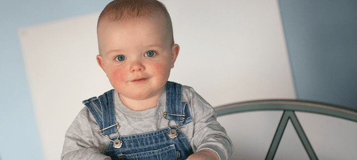 Let's Play Child looking into camera smiling