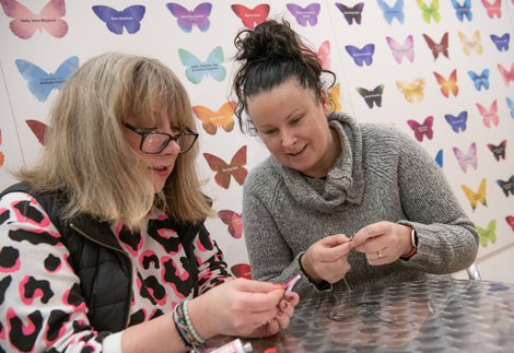 two women doing crafts 