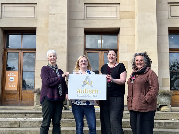 Museum staff being presented with Autism Acceptance Award