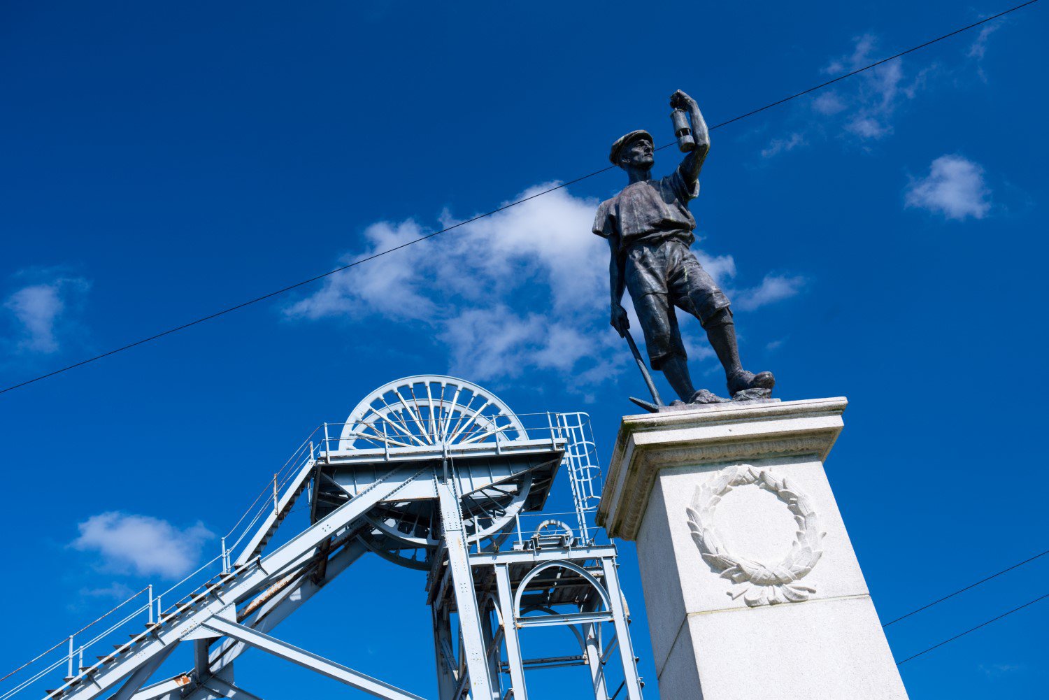 The Miners' Memorial statue at Woodhorn in front of the colliery building The Miners' Memorial statue at Woodhorn in front of the colliery building
