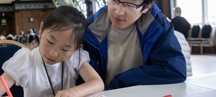 dad and daughter work together 