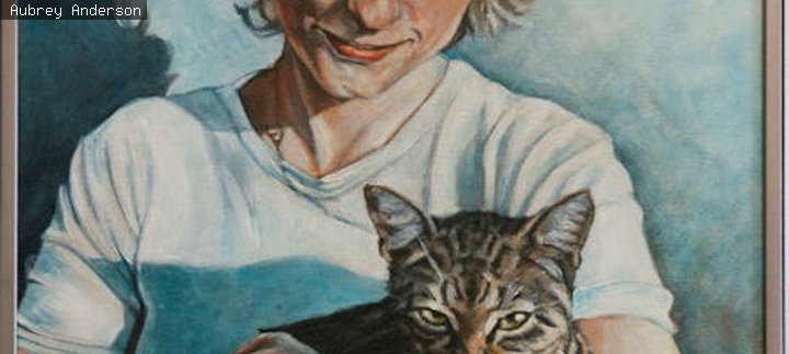 Woman cradling a cat