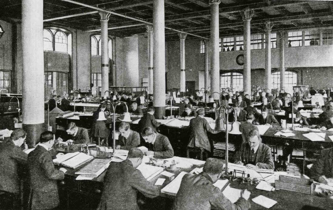 A group of clerks working at their desks in 1901
