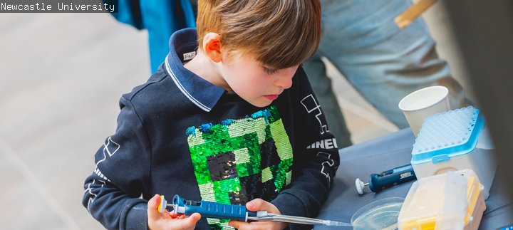 A child is doing a science activity