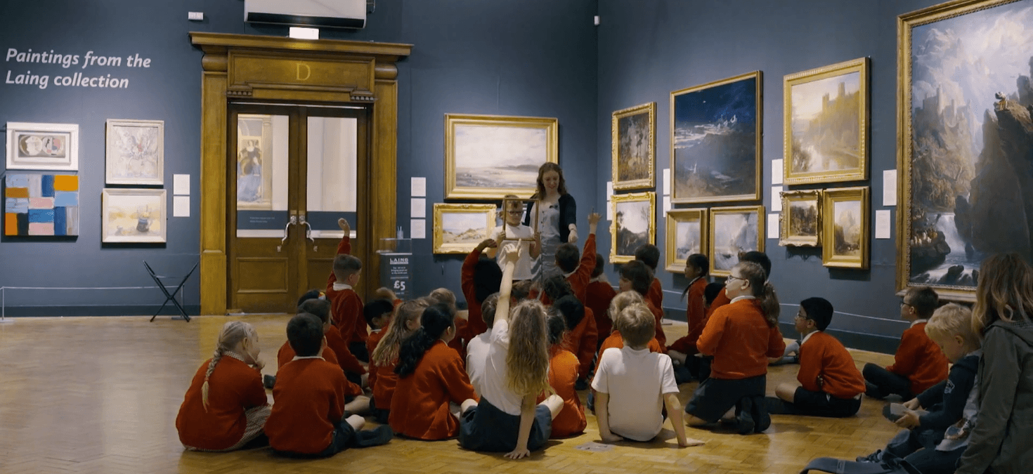 school children sitting down in the gallery 