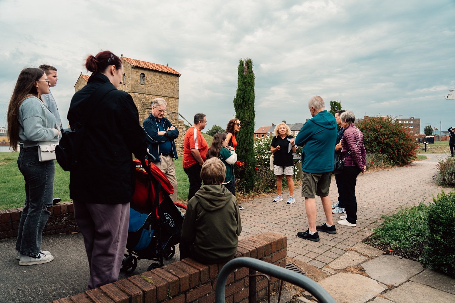 Crowd of people with a tour guide.