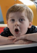 little boy playing in the museum