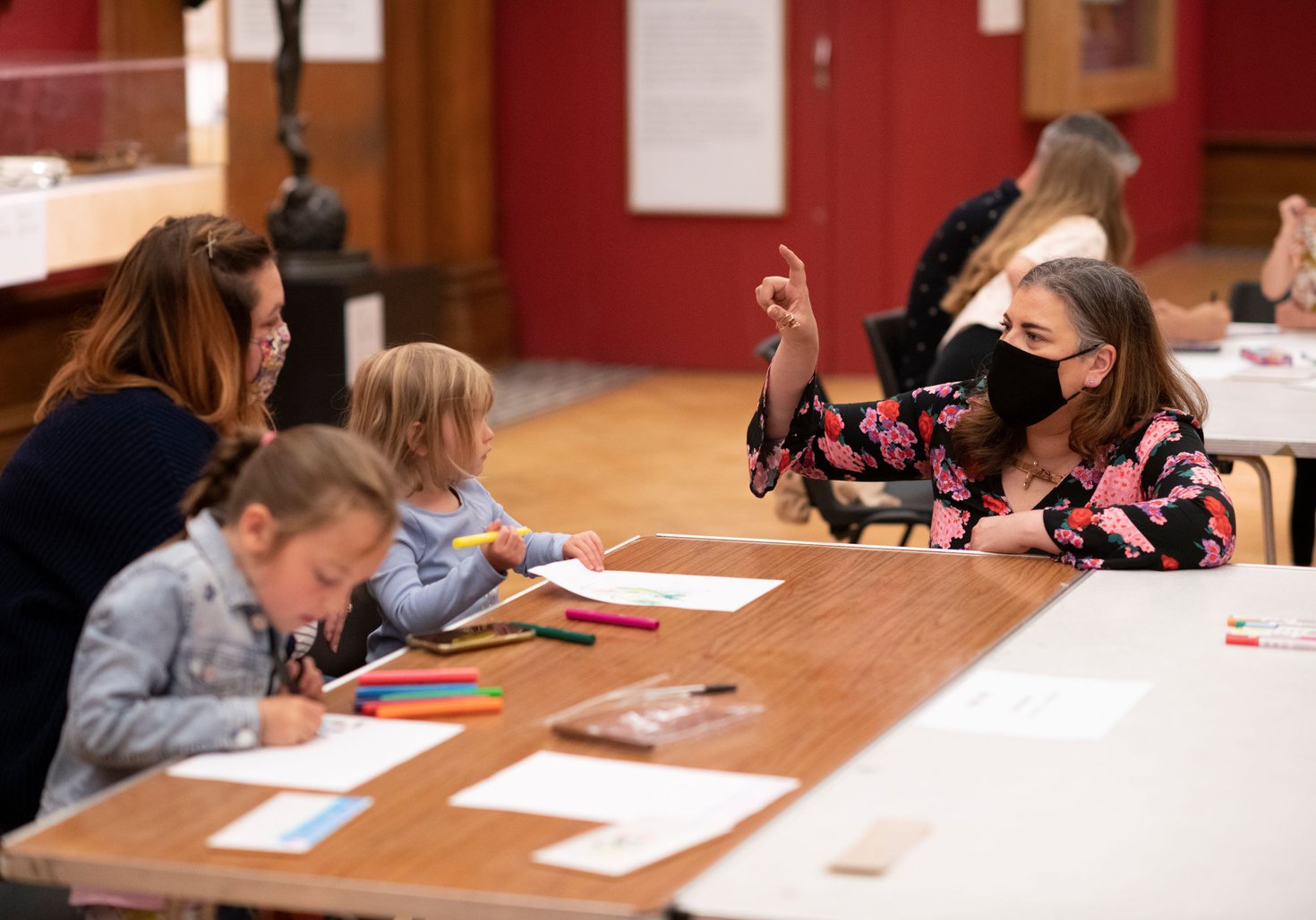 Artist with family making artistic creations
