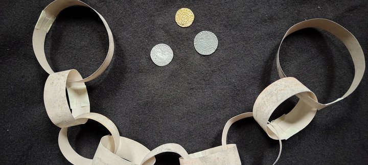 Paper manacles and coins