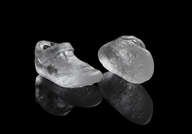 A pair of trainers made from glass.