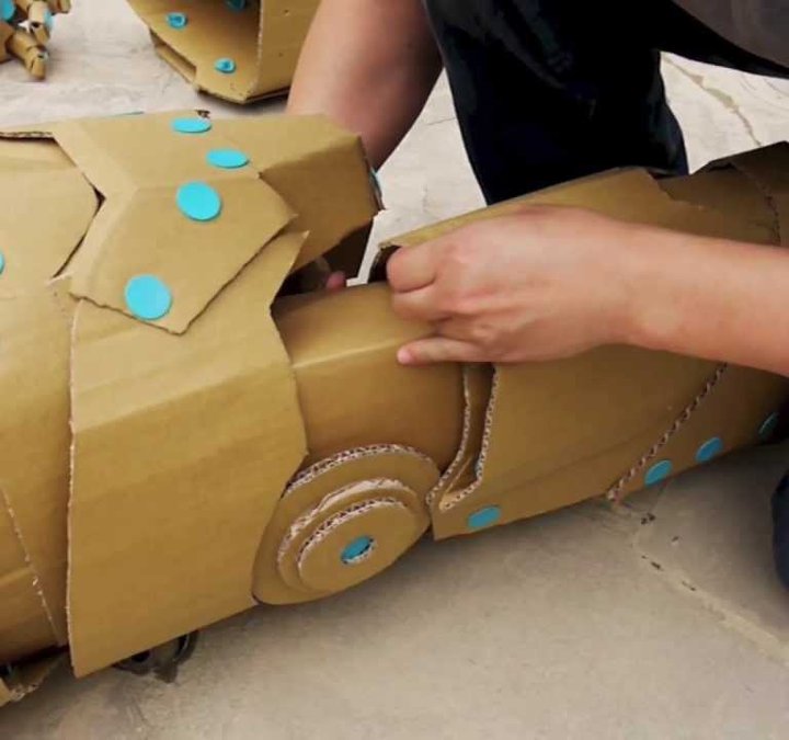 Recycled cardboard being constructed into a vehicle