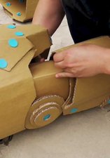 Recycled cardboard being constructed into a vehicle