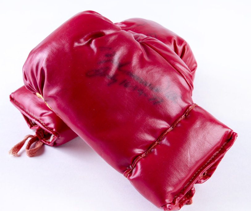 A pair of junior boxing gloves autographed by Muhammad Ali at South Shields, 16 July 1977. 