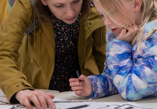 Parent and child drawing together 