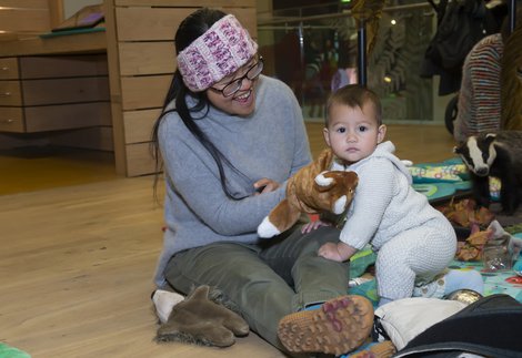 A baby with an adult