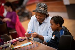 A photograph of a mum and child crafting.