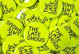 Lots of neon The Late Shows pin badges