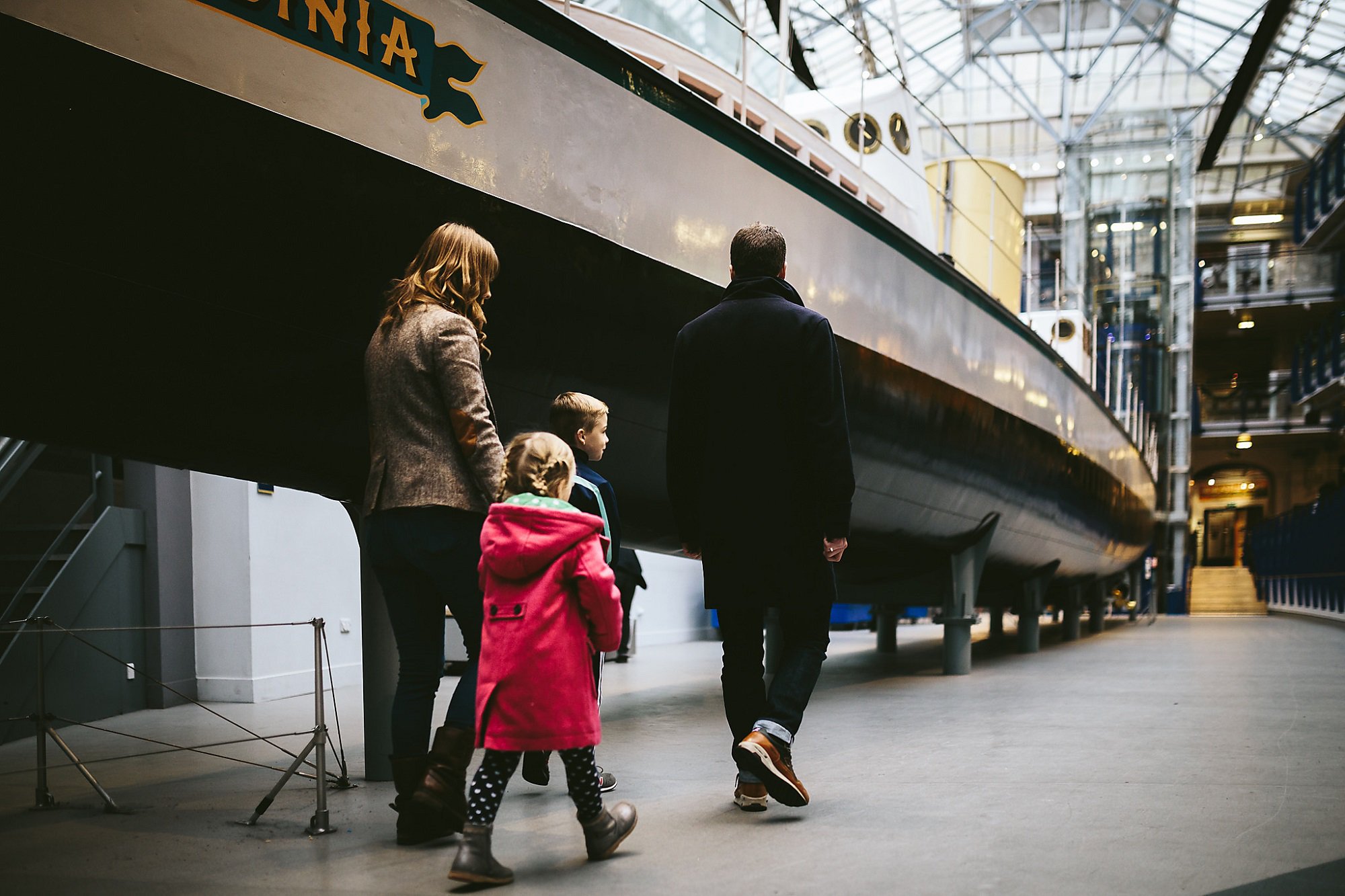 A family walks past Turbinia at Discovery Museum