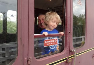 Man and boy at train carriage window