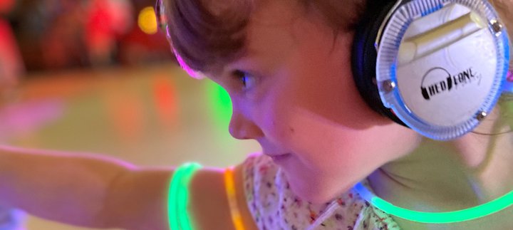 Young girl with headphones dances
