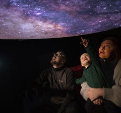 A family in a planetarium 