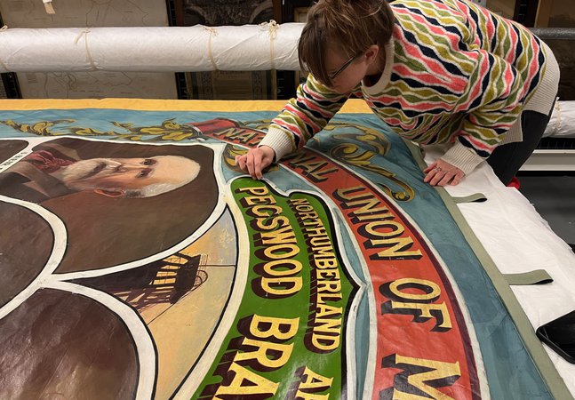 A banner being conserved at Woodhorn Museum
