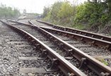 Railway tracks stretching towards the platform