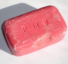 Bar of soap bought by donor's father for use in pit head baths of Boldon Colliery. Soap is pink in colour and has never been used.