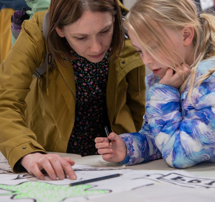 Parent and child drawing together 