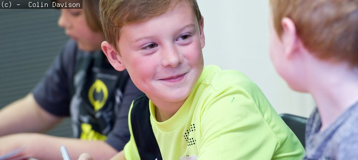 Two boys talking at an art academy day