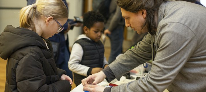 Children learning from an adult