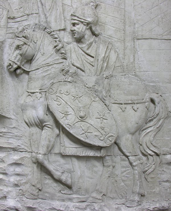 Stone sculpture of Roman soldier on horseback with shield