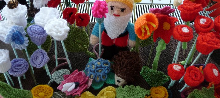 A knitted gnome and flowers