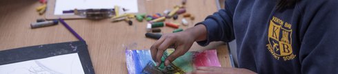 child making pastel drawing