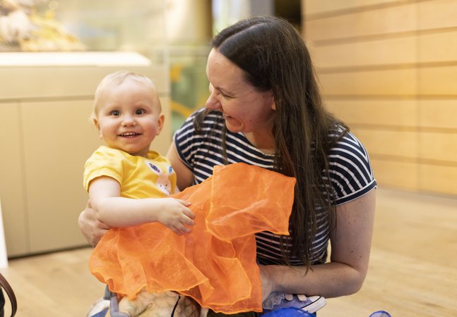 Woman and baby smiling