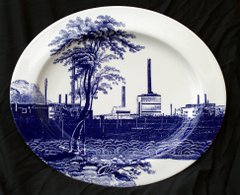 Cumbrian Blue(s), Sellafield No:9, 5/5. Transfer print collage on bone china platter with platinum, 410mm x 345mm x 24mm. Paul Scott 2005.