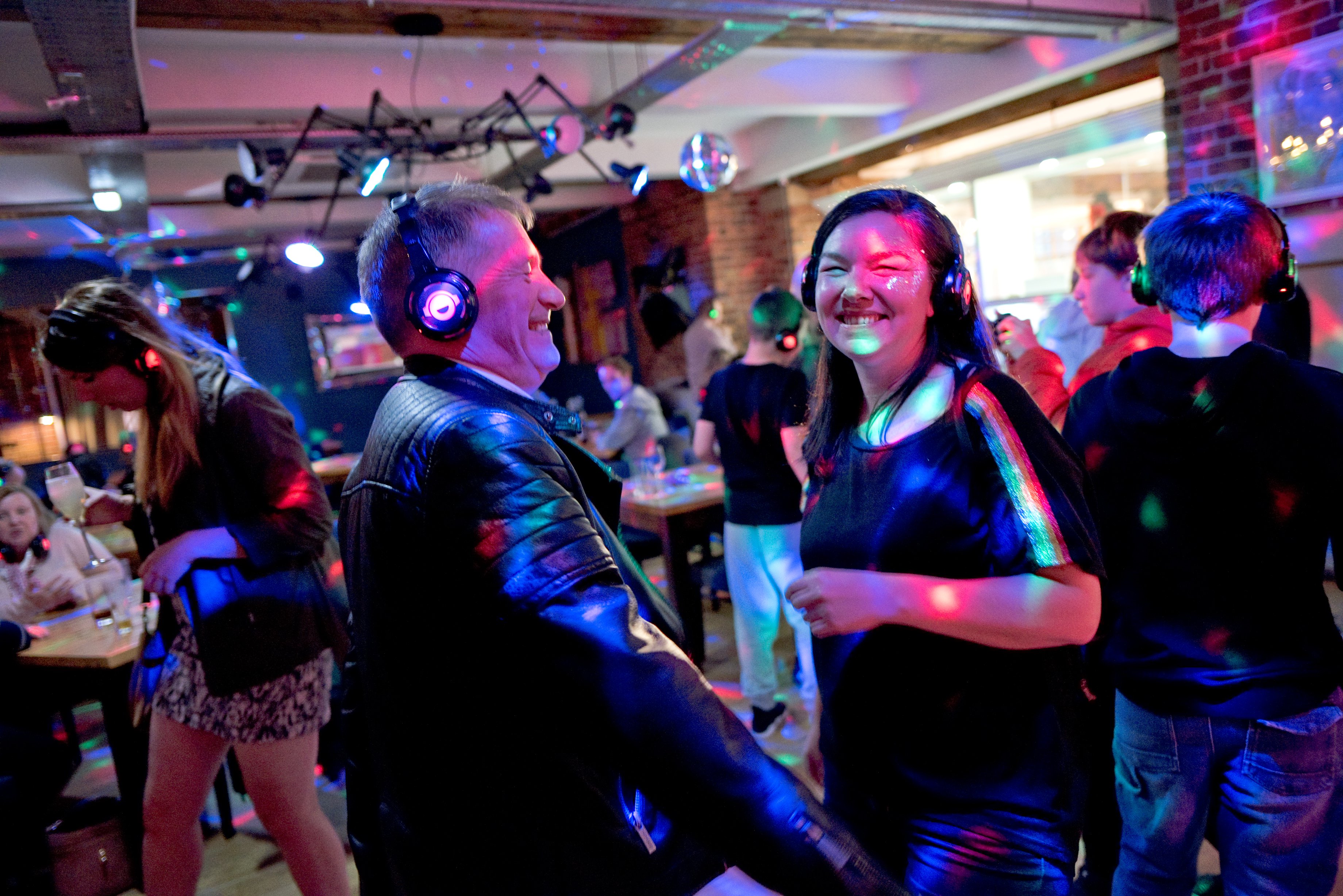 Late Shows - two people are dancing at a silent disco