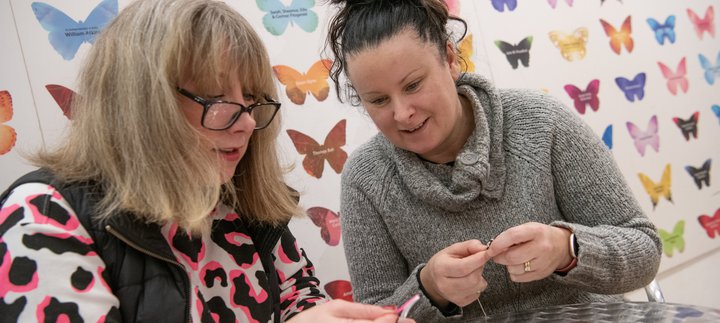 two women doing crafts