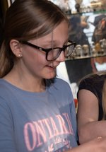 Two girls look at connections in the gallery 