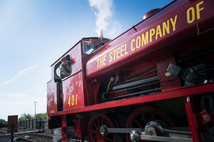 Red locomotive with driver