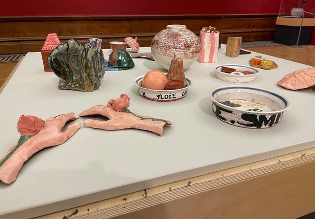 a photo of clay pieces displayed in the gallery