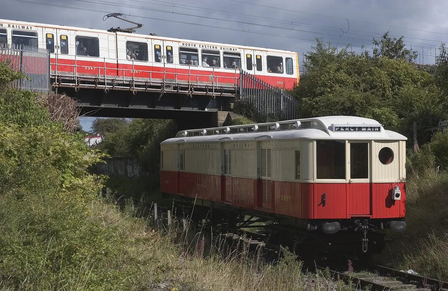 Original 1904 NER Tyneside Electric carriage No 3267 in the foreground with Tyne & Wear Metrocar 4027 painted in commemorative NER livery in the background.