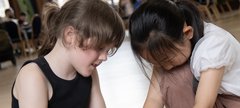 two girls working together in an event  