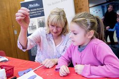 Girl and woman doing craft activity